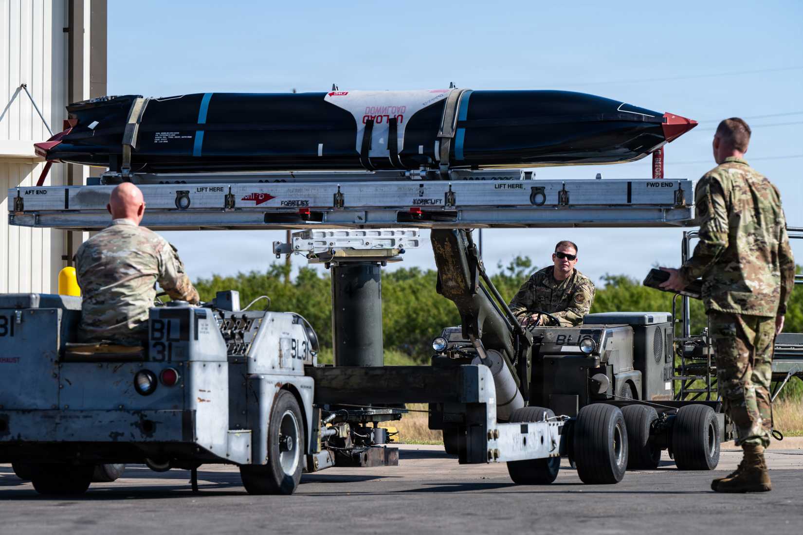 Airmen transport an AGM-158C Long Range Anti-Ship Missile at Dyess Air Force Base, Texas, Sept. 15, 2025