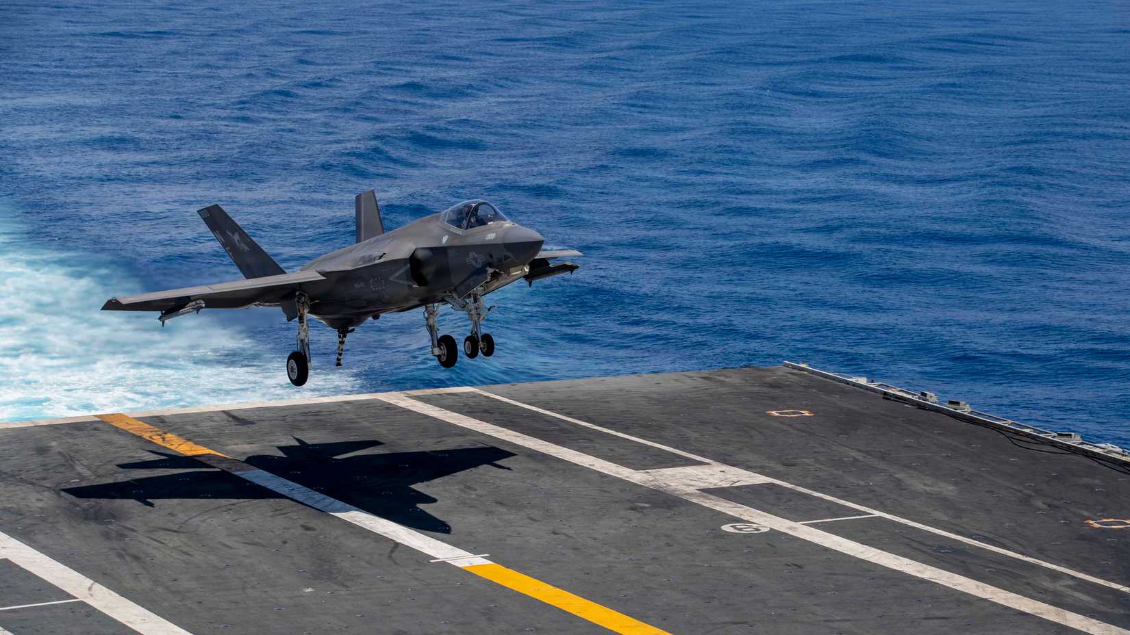 An F-35C Lighting II, attached to Strike Fighter Squadron (VFA) 147, lands on the flight deck of Nimitz-class aircraft carrier USS George Washington (CVN 73)