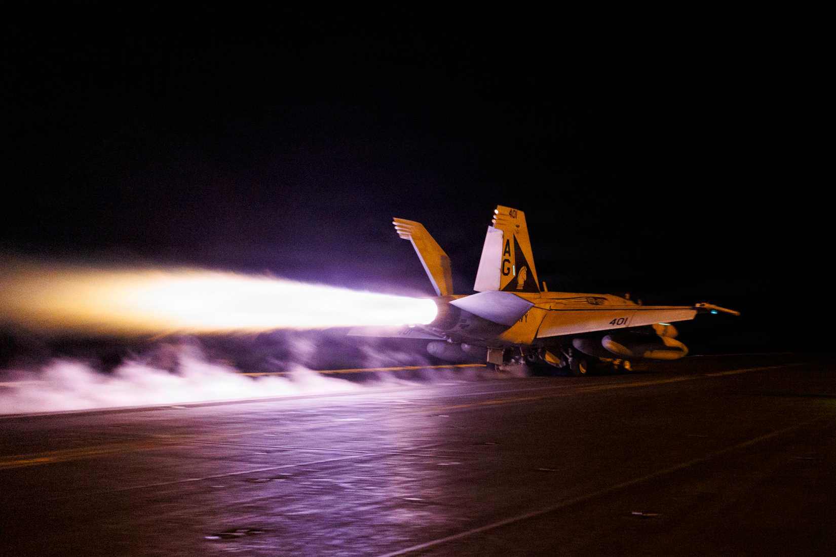 An F⁄A-18E Super Hornet, attached to Strike Fighter Squadron (VFA) 105, launches from the flight deck of Nimitz-class aircraft carrier USS George H.W. Bush (CVN 77)