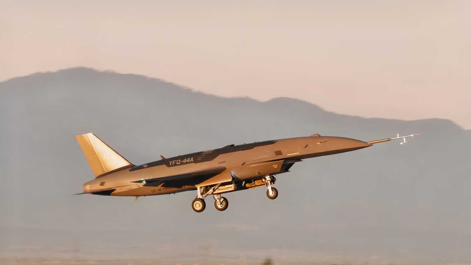 A photo of the Anduril YFQ-44A Fury drone either moments after takeoff or about to make a landing. 