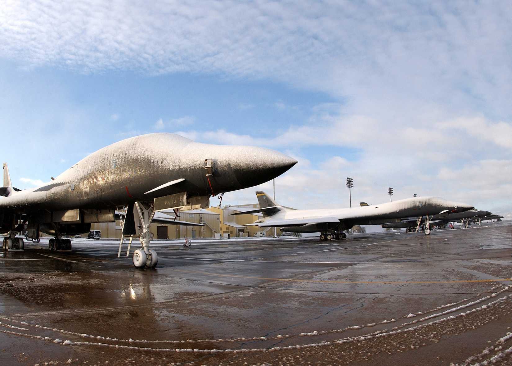 B-1 Lancers sit on the flight line covered in snow after an early snow storm at Ellsworth Air Force Base, South Dakota, on Oct. 5, 2005