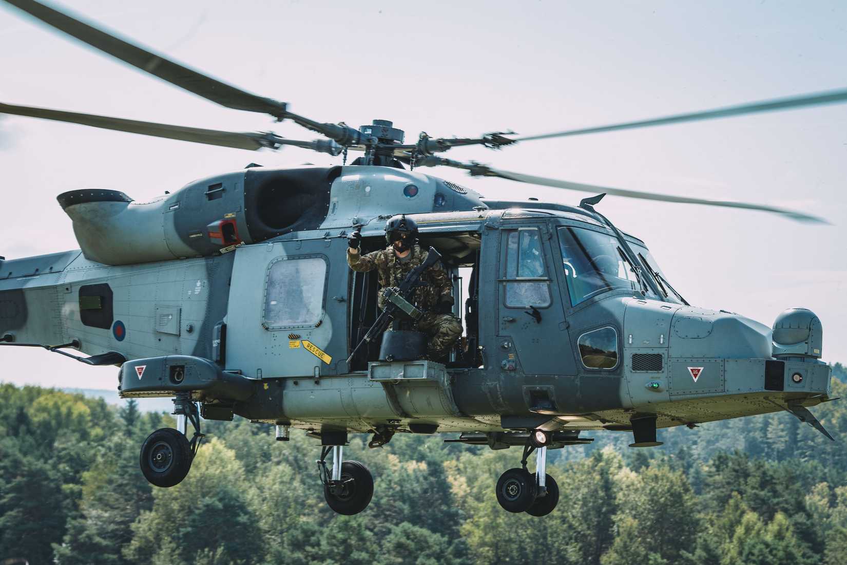 British Army soldiers take flight in an AW-159 Wildcat helicopter during exercise Saber Junction 24