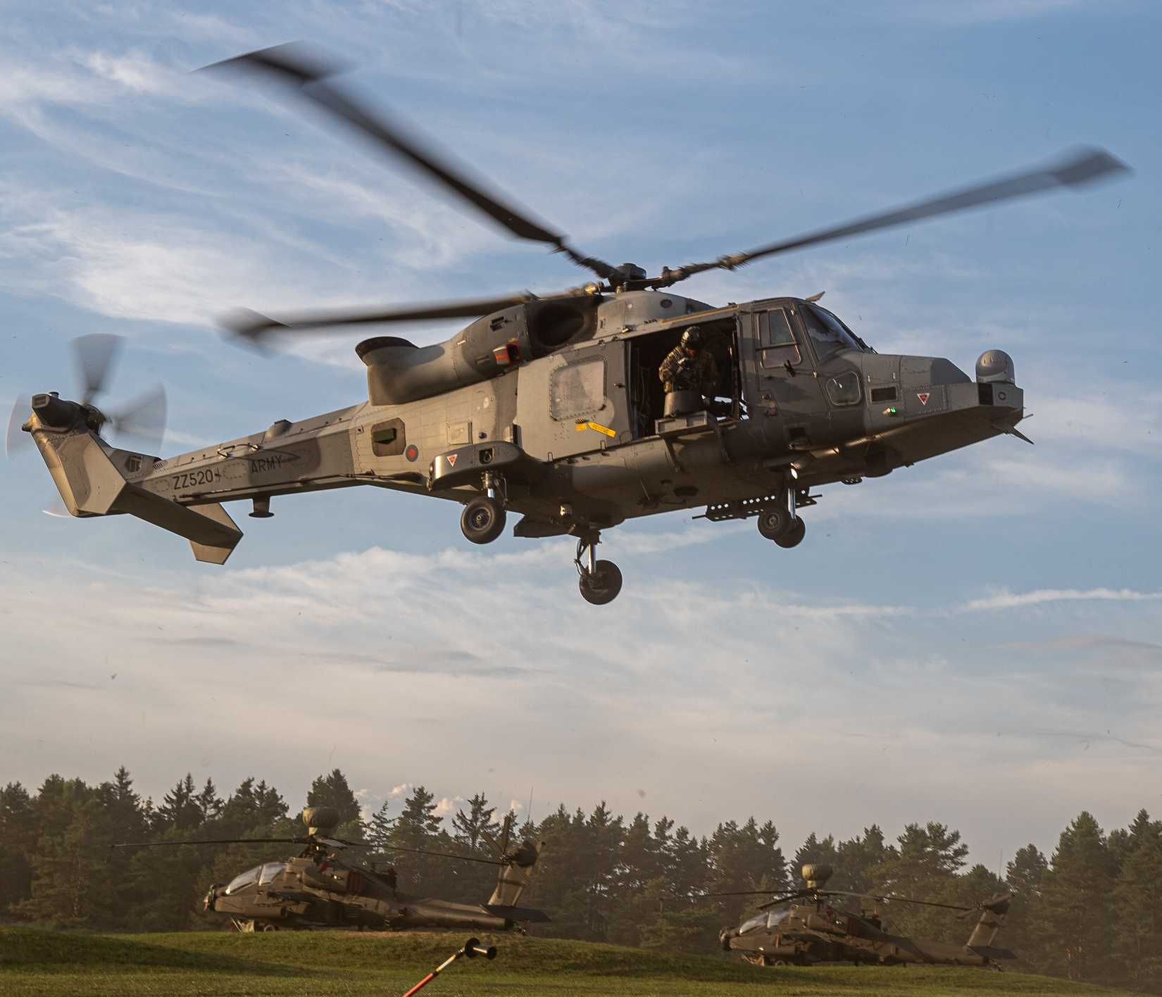 British soldiers assigned to the 4th Regiment Army Air Corps prepare to land a AW159 Wildcat helicopter during Saber Junction 24