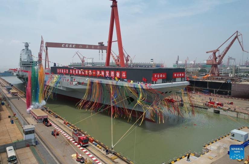 China's third aircraft carrier, the CNS Fujian, is towed out of its dry dock at China State Shipbuilding Corp's Jiangnan Shipyard Group in Shanghai