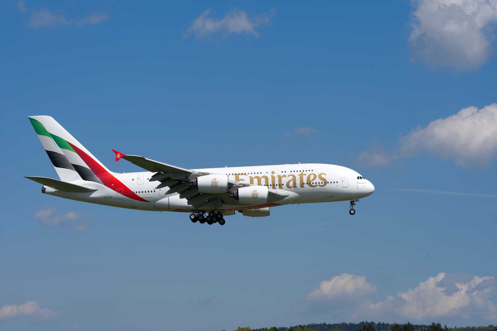 Emirates A380 flying across clear skies