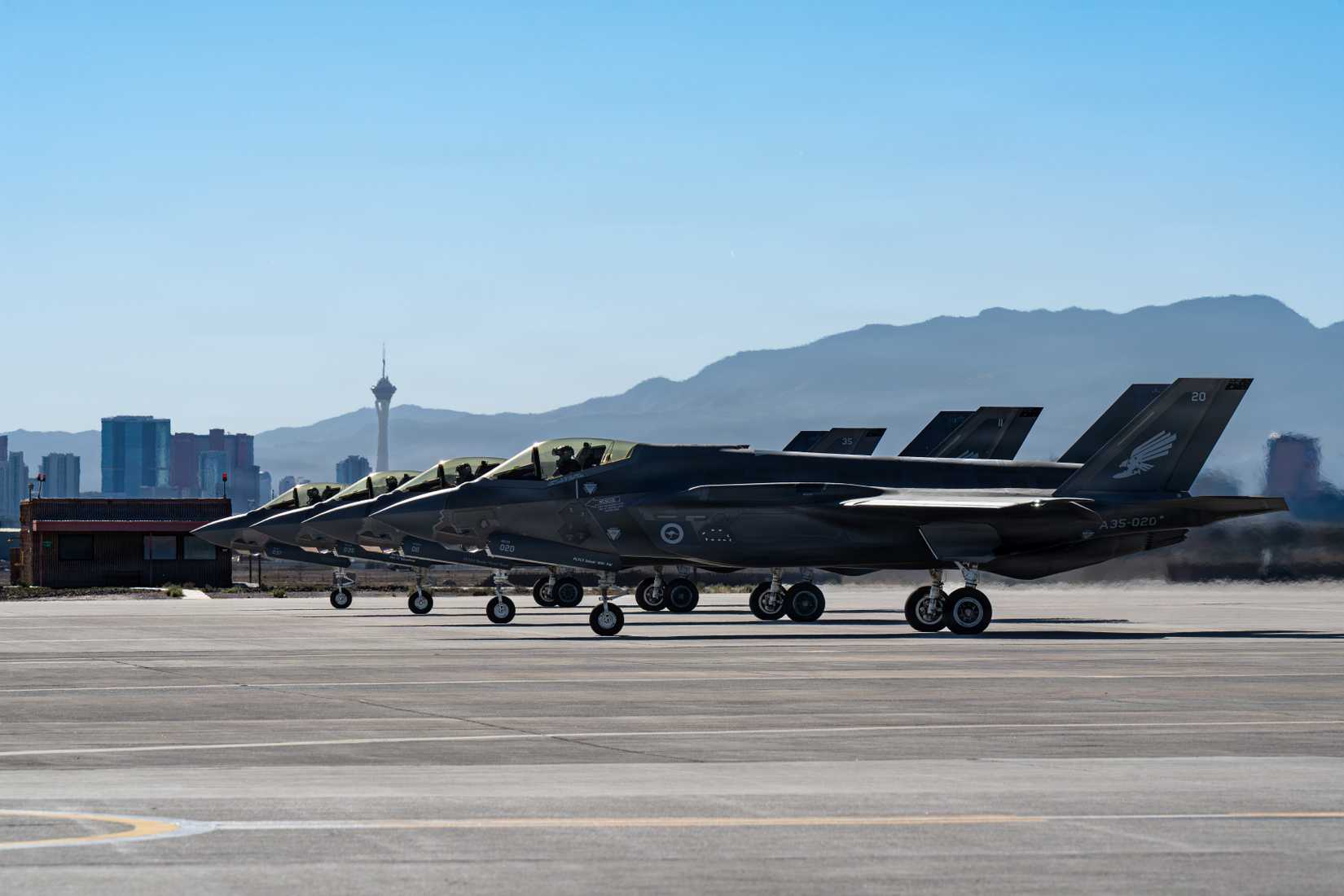 Four Royal Australian Air Force F-35A Lightning II aircraft prepare to taxi out for a mission during Red Flag-Nellis 26-1, at Nellis Air Force Base, Nevada, Feb. 4, 2026.