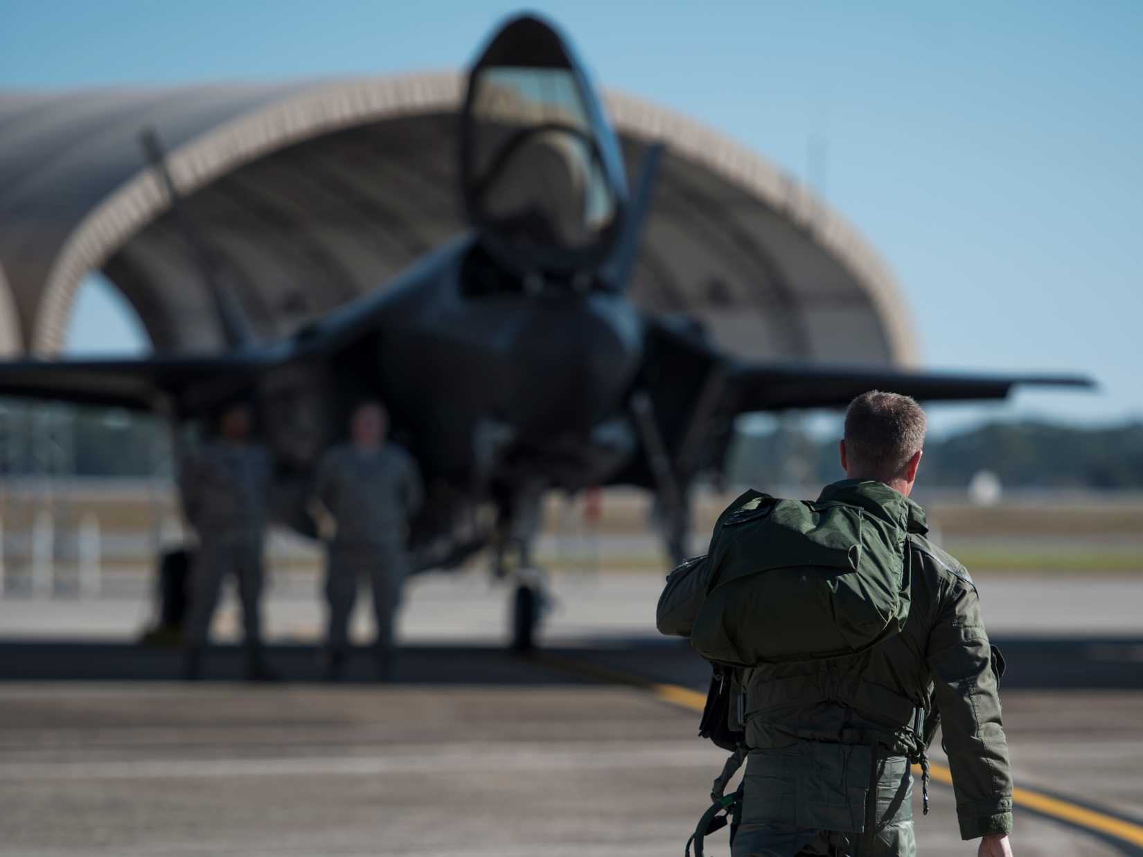 Lt. Col. Jared Santos, 513th Electronic Warfare Squadron commander, walks to an F-35A Lightning II Nov. 14, 2017, at Eglin Air Force Base, Fla.