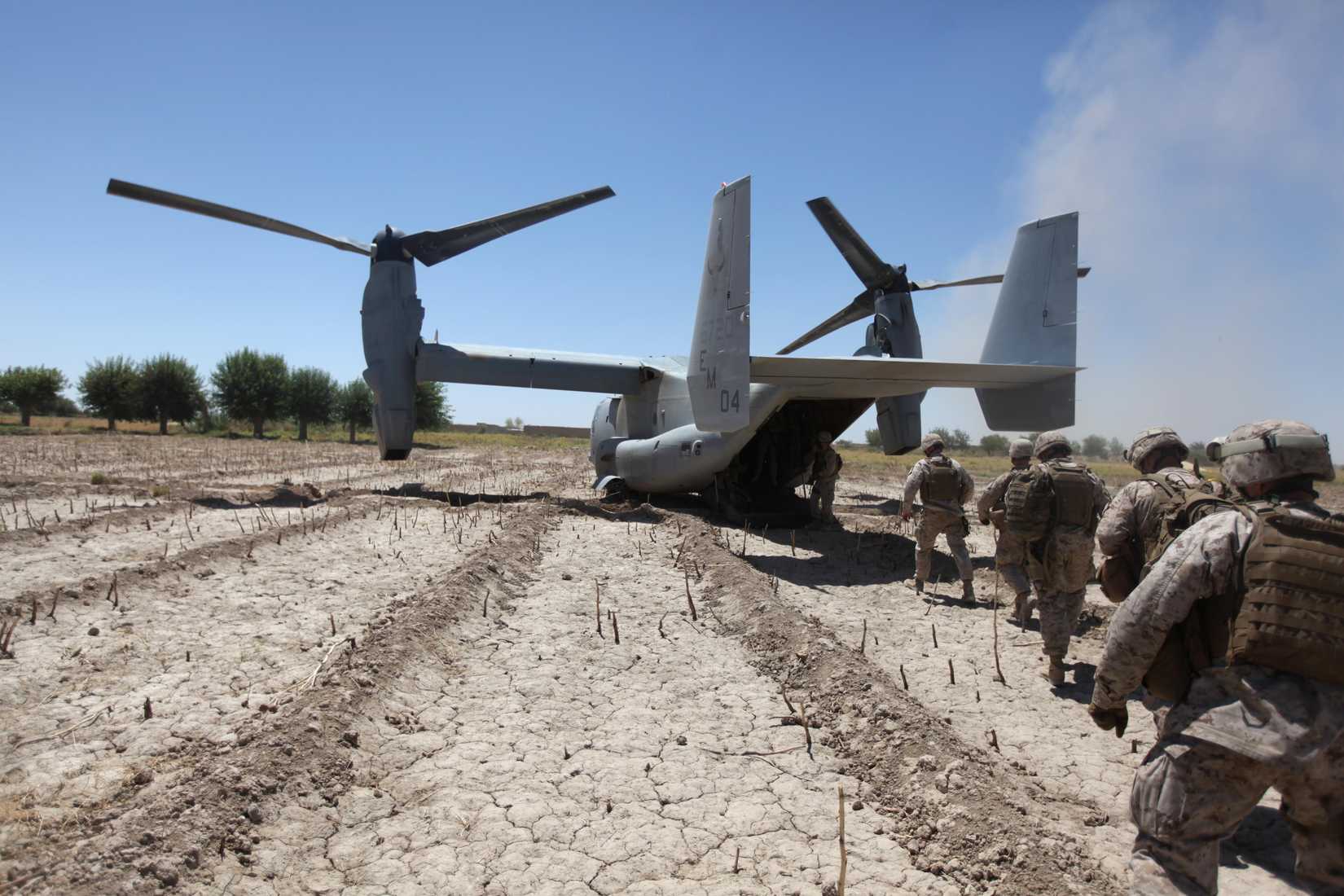 Marines board a V-22 Osprey aircraft at Control Base Karma in the Helmand province of Afghanistan on June 9, 2010