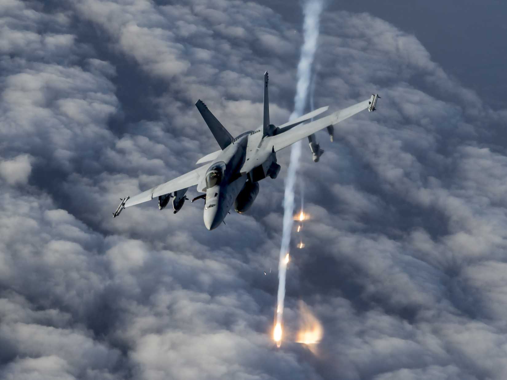 Navy FA-18E Super Hornet releases flares over Afghanistan, Jan. 23, 2020.