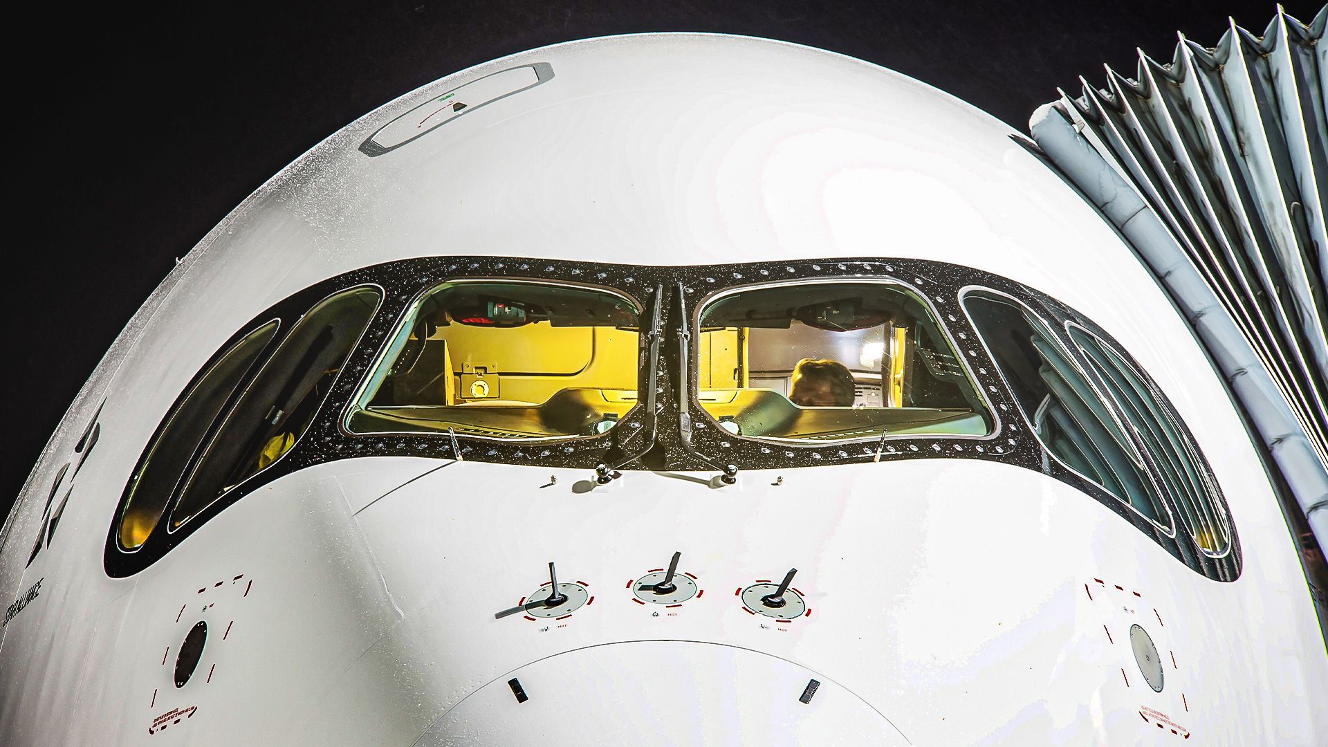 The nose of an A350-900ULR with the pilots visible