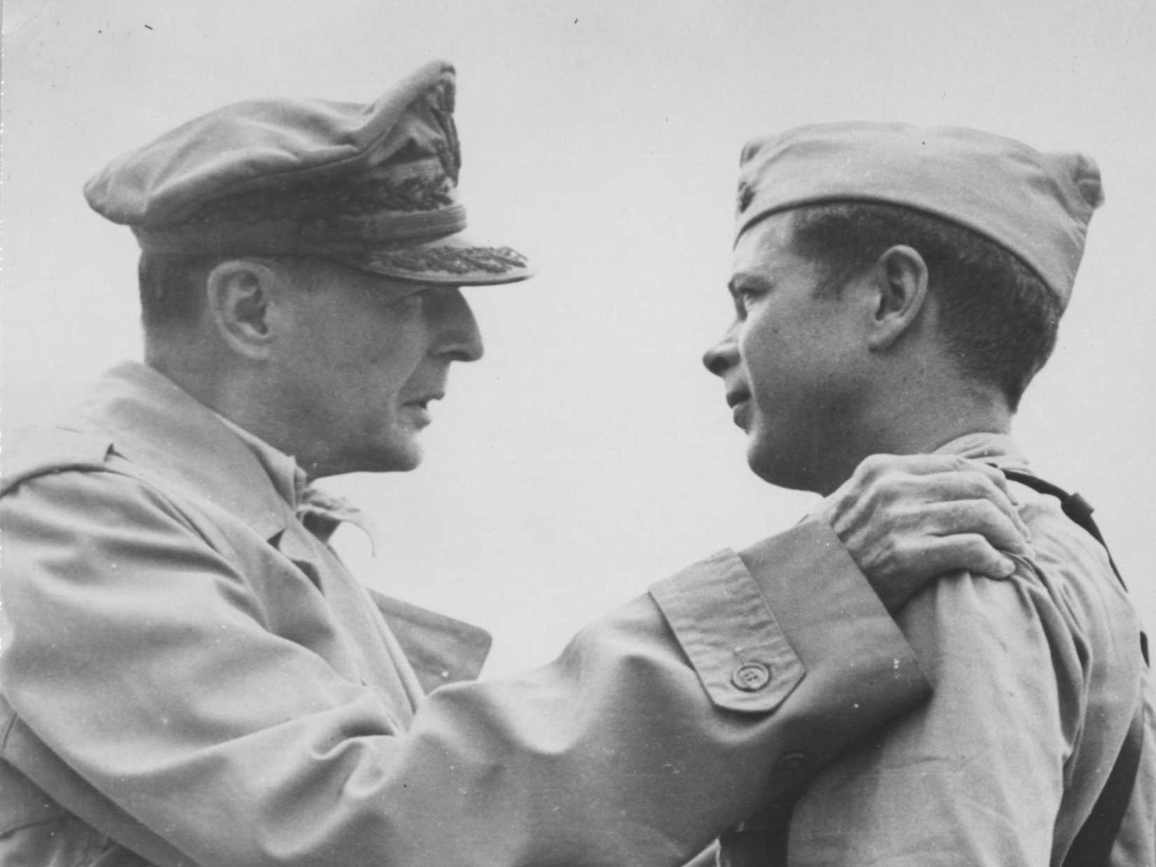 On An Airstrip On Leyte Island, Philippine Islands, General Douglas Macarthur Congratulates Major Richard Ira Bong, Whose 38 Victories Make Him America'S Top Fighter Pilot, After Awarding Him The Congressional Medal Of Honor.