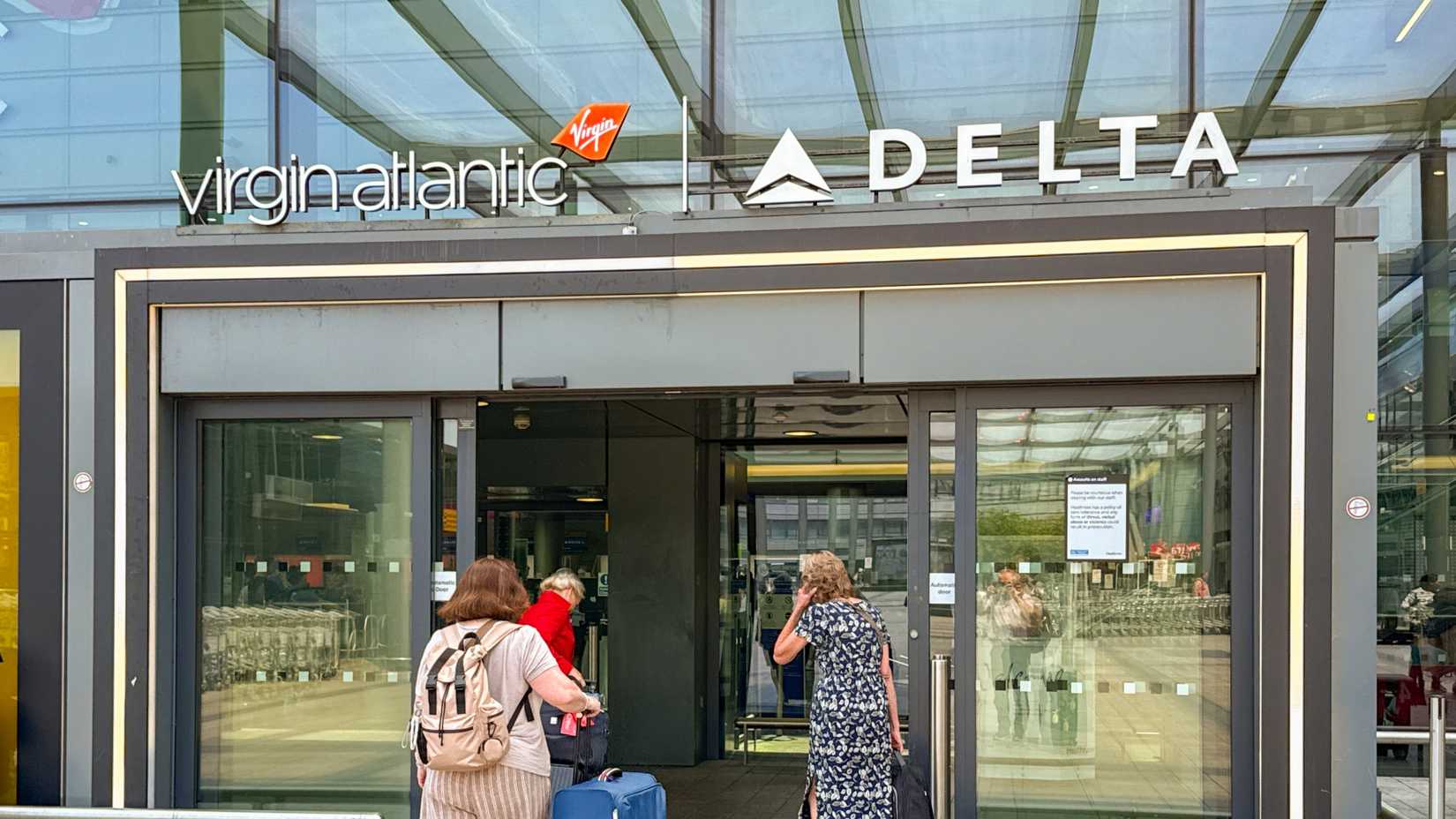 Passengers entering the Virgin Atlantic and Delta Air Lines area of the departures hall at Terminal 3 at London Heathrow airport