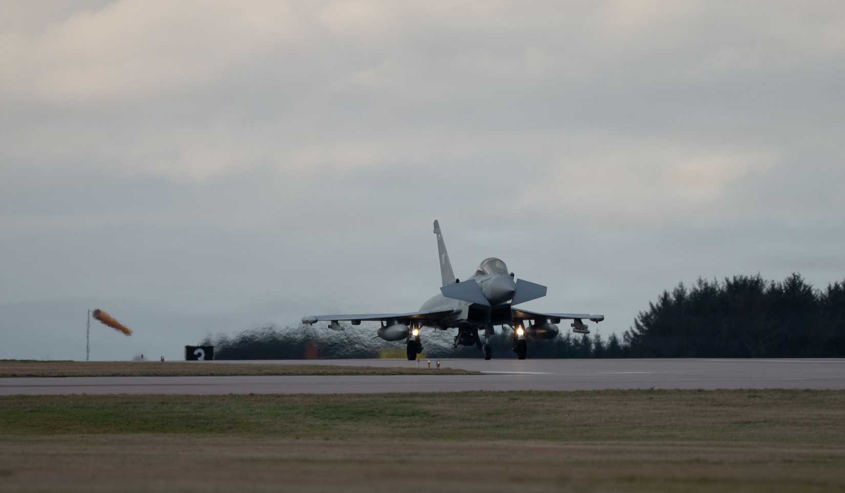 Royal Air Force Typhoon FGR4 aircraft assigned to IX(B) Squadron lands on the runway at RAF Lossiemouth, Scotland,
