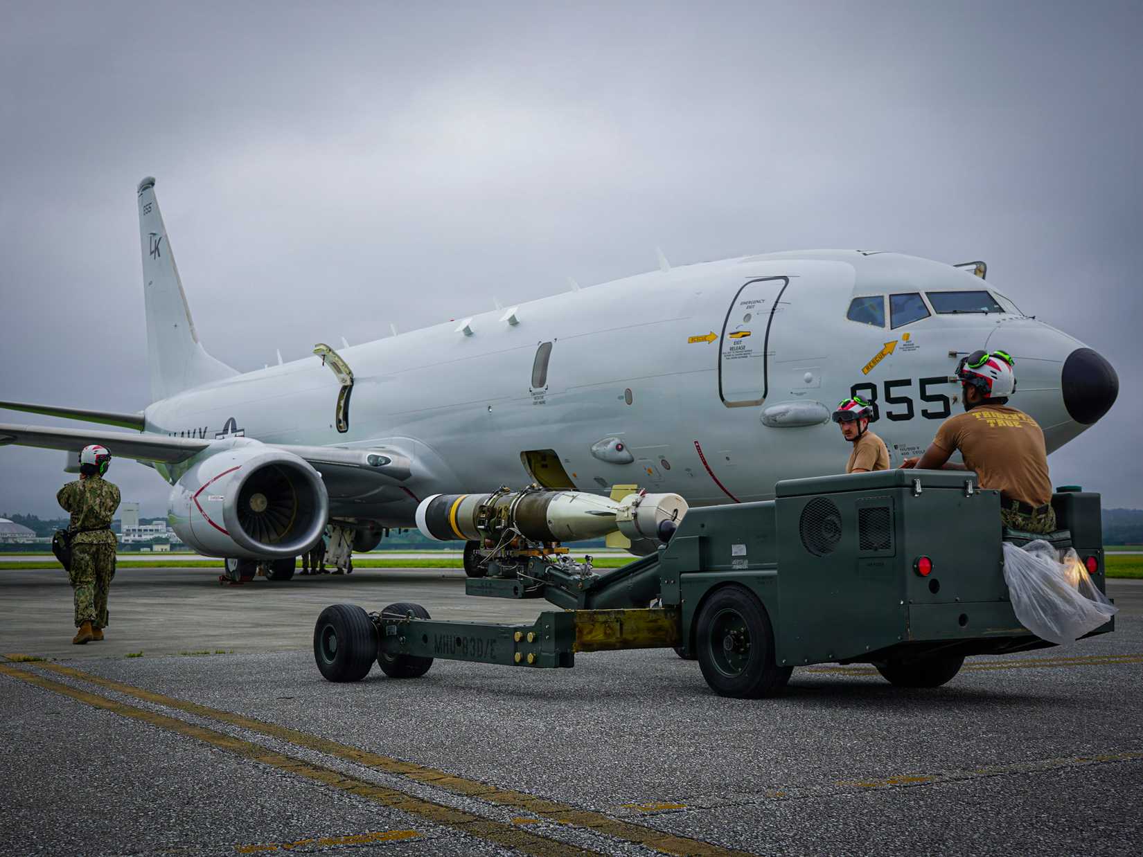 Sailors assigned to Patrol and Reconnaissance (VP) 26 prepare to load a Mark 54 lightweight torpedo onto a P-8A Poseidon on Kadena Air Base, Japan, June 5, 2026.