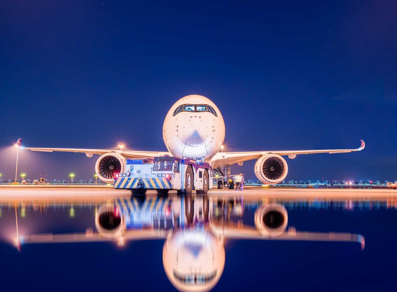 Airbus A350 and its reflection in the lake, evening light