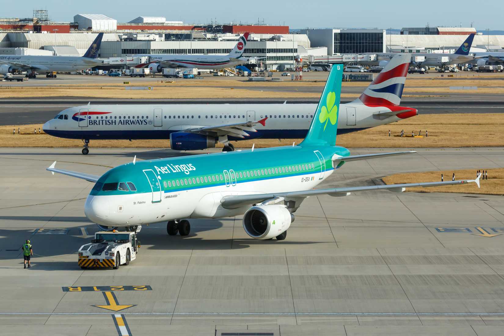 Aer Lingus Airbus A320-200 Pushing Back With British Airways Airbus A321-200 Taxiing Behind
