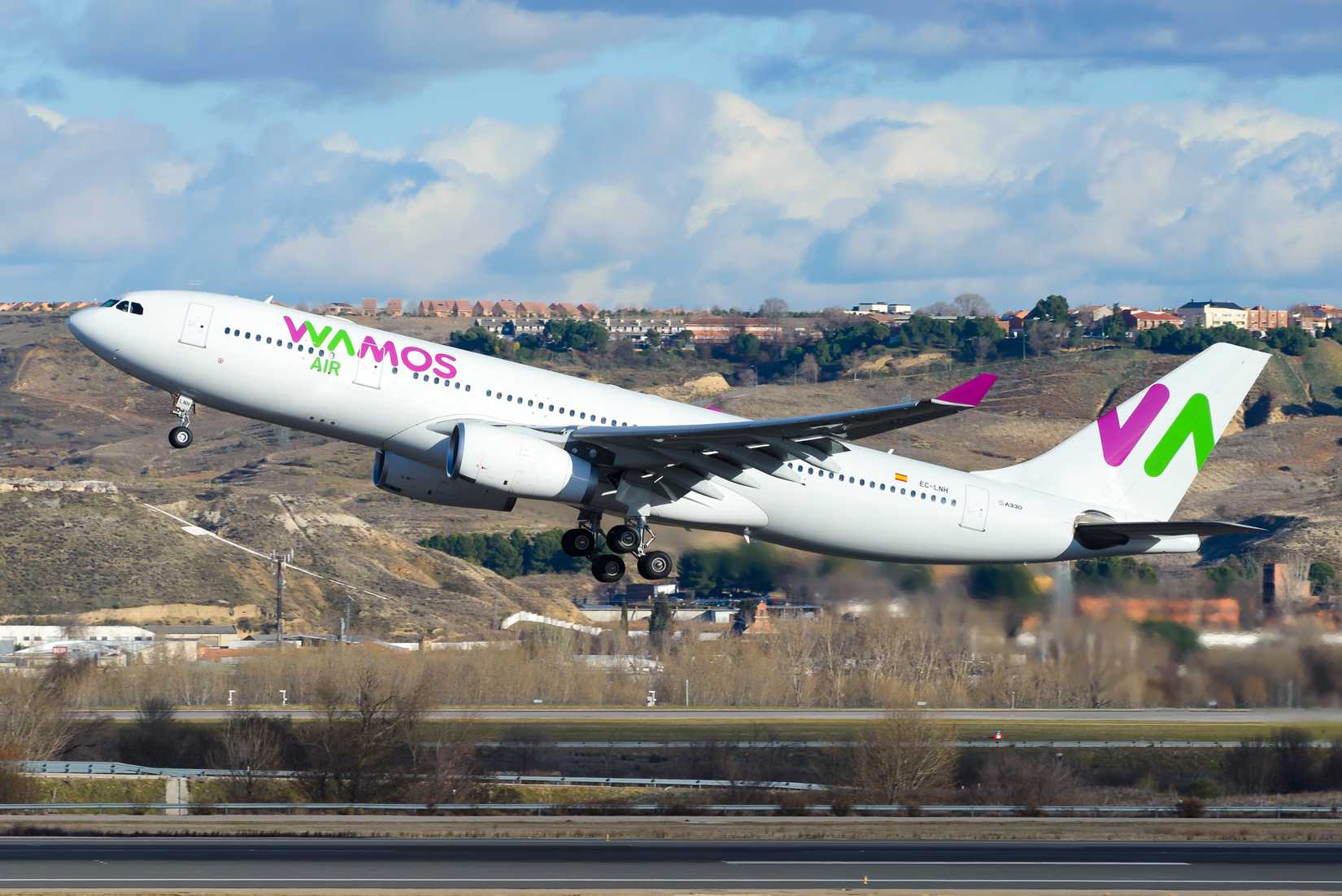 Wamos Air Airbus A330-200 aircraft departing