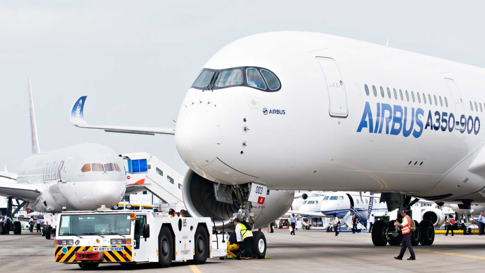 Airbus A350 Parked By Qatar Airways Boeing 787