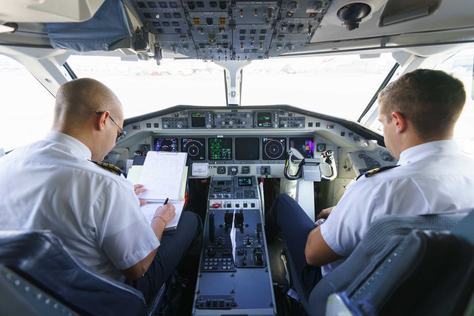 Etihad Regional pilots in aircraft cockpit on September 16, 2014 in Geneva, Switzerland. Darwin Airline, operating under the brand name Etihad Regional since January 2014