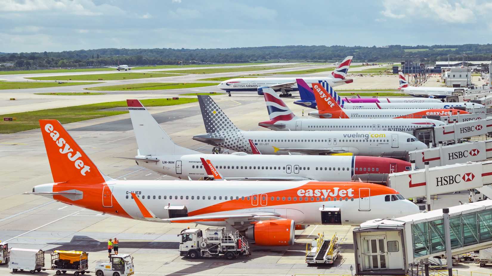 London, England, UK - 1 August 2023: Holiday jets lined up at London Gatwick Airport