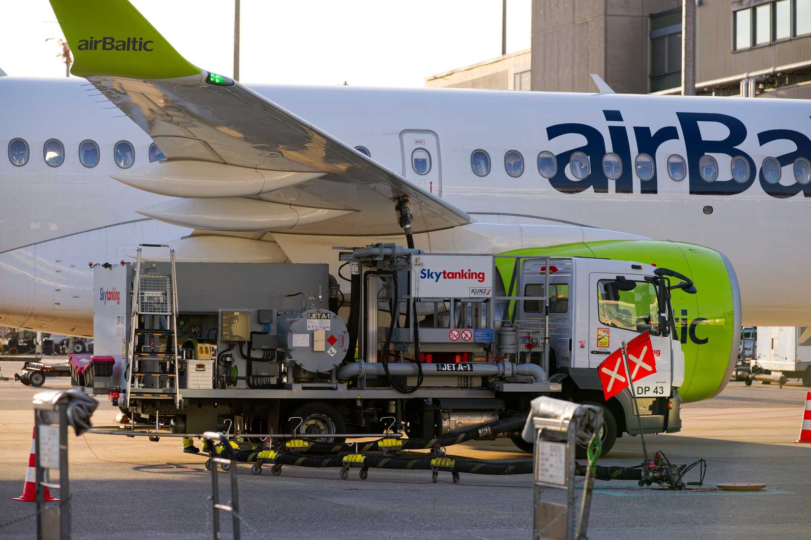 Close-up of Air Baltic passenger airplane Airbus A220-300 registration YL-ABP parked at Swiss Airport Zürich Kloten on a spring sunset. Photo taken April 8th, 2025, Zurich Kloten, Switzerland.