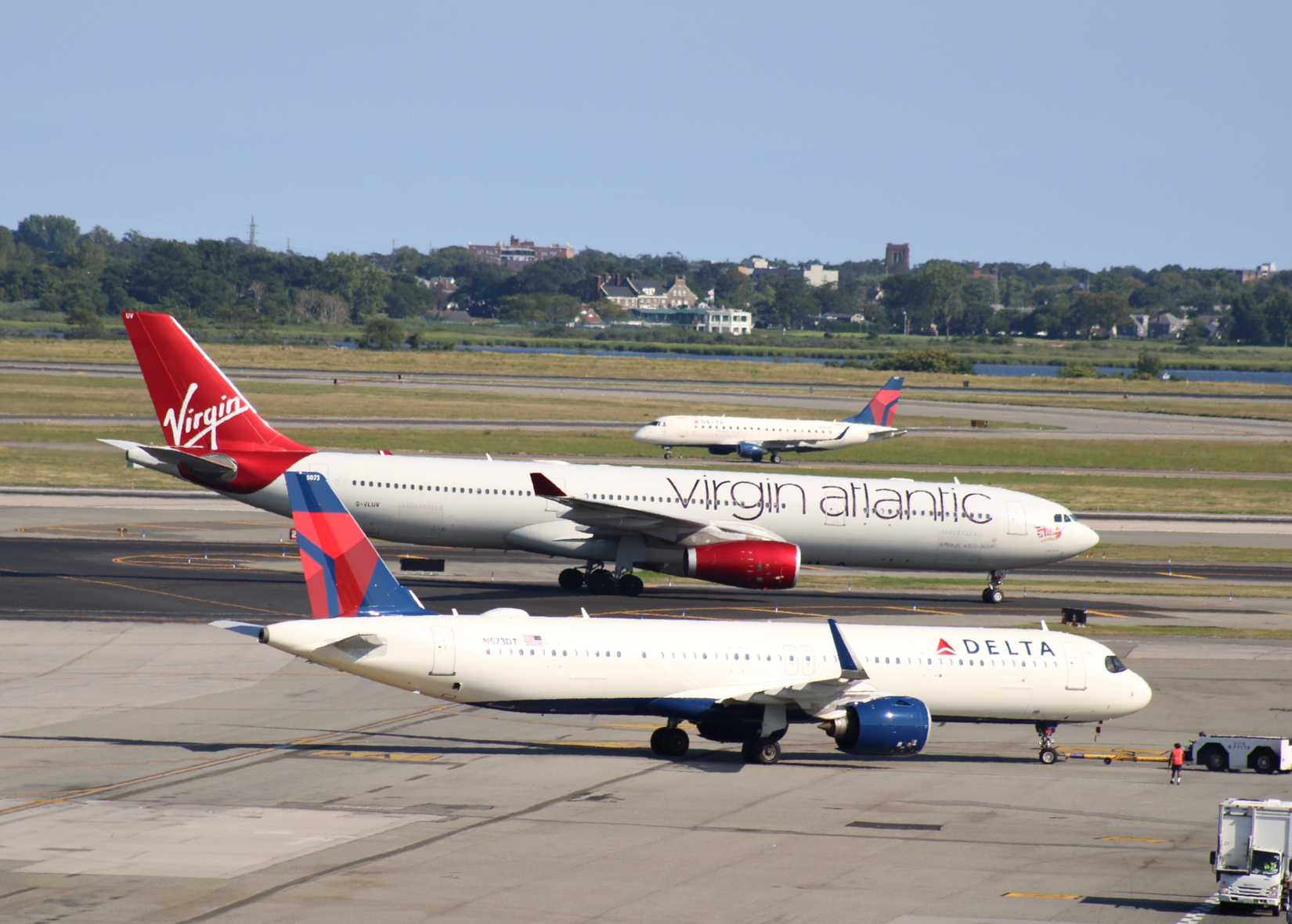 New York, USA - 25 July, 2025: Virgin Atlantic Airways and Delta Air Lines Airbus A330-900neo, Boeing 767-300ER, Embraer ERJ  and A321neo airplane at John F Kennedy (JFK) International Airport.