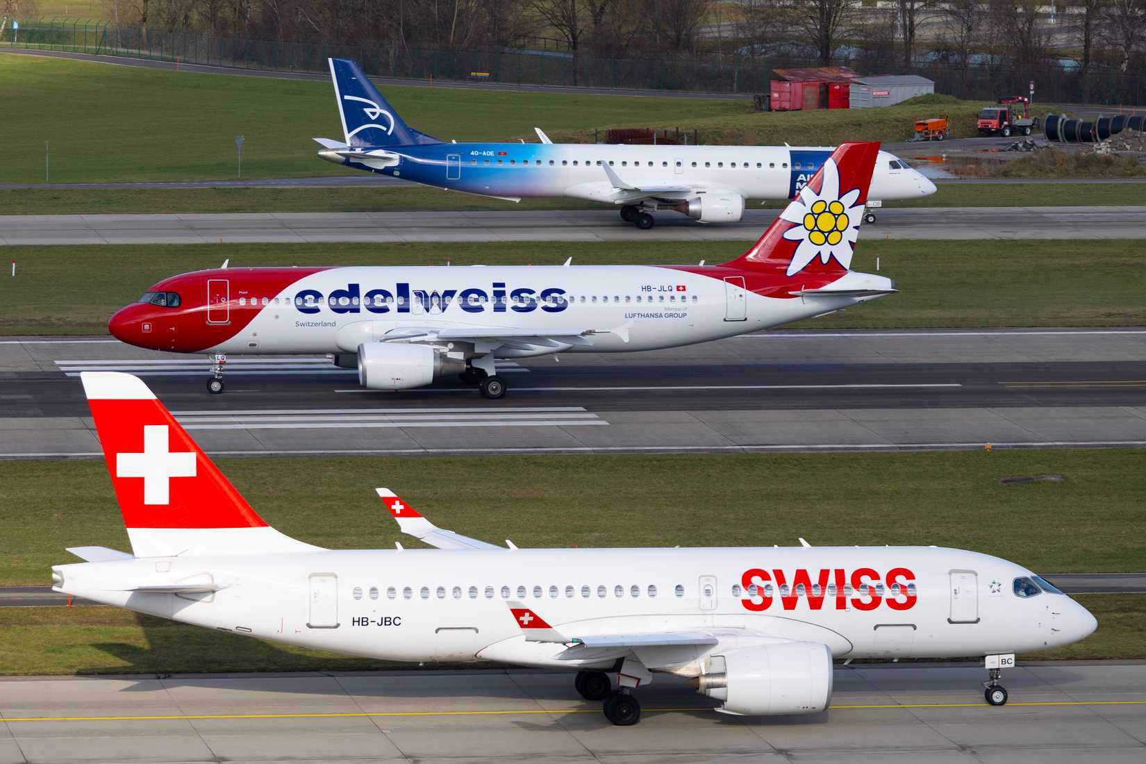 Zurich, Switzerland - November 27, 2025: Airport traffic at Zurich Kloten airport - Swiss Airlines Airbus A220-100 (Bombardier CS-100), Edelweiss Airbus A320 and Air Montenegro Embraer 195