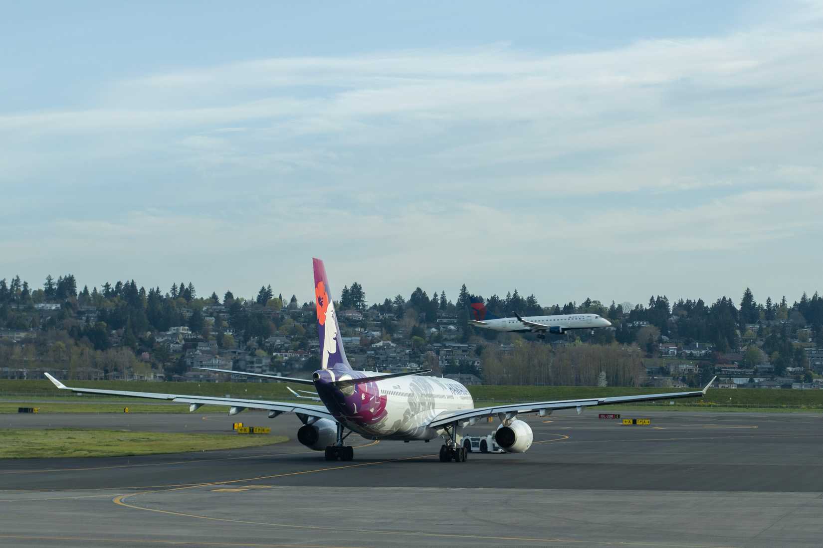 Delta E-Jet Landing Behind Hawaiian A330