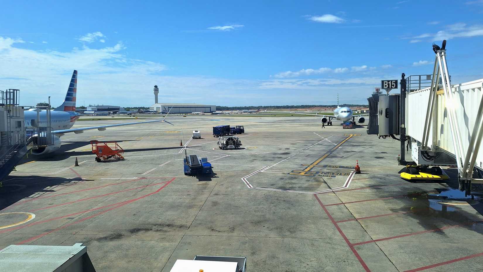 Charlotte, NC, USA - April 30, 2026: Aircraft sit on the tarmac at Charlotte Douglas International Airport, on a beautiful sunny day.