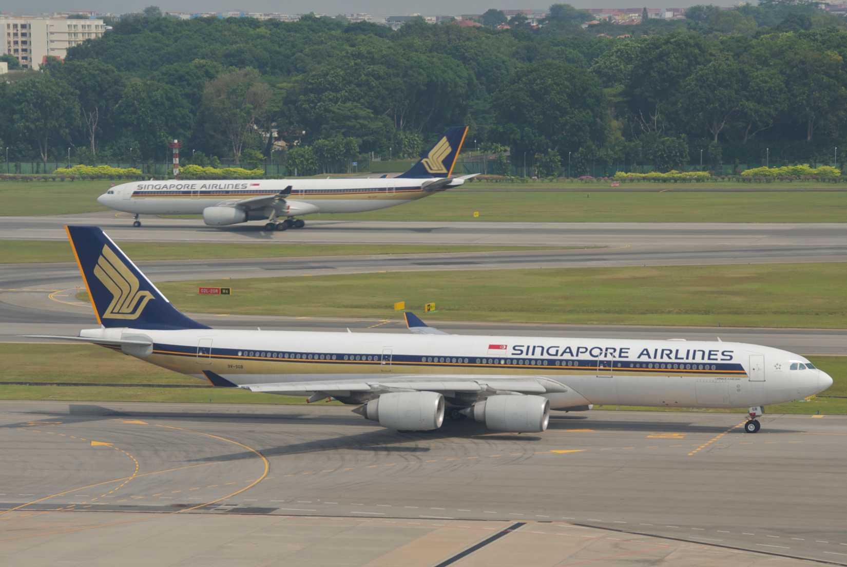 Singapore Airlines A340 on taxiway with A330 behind