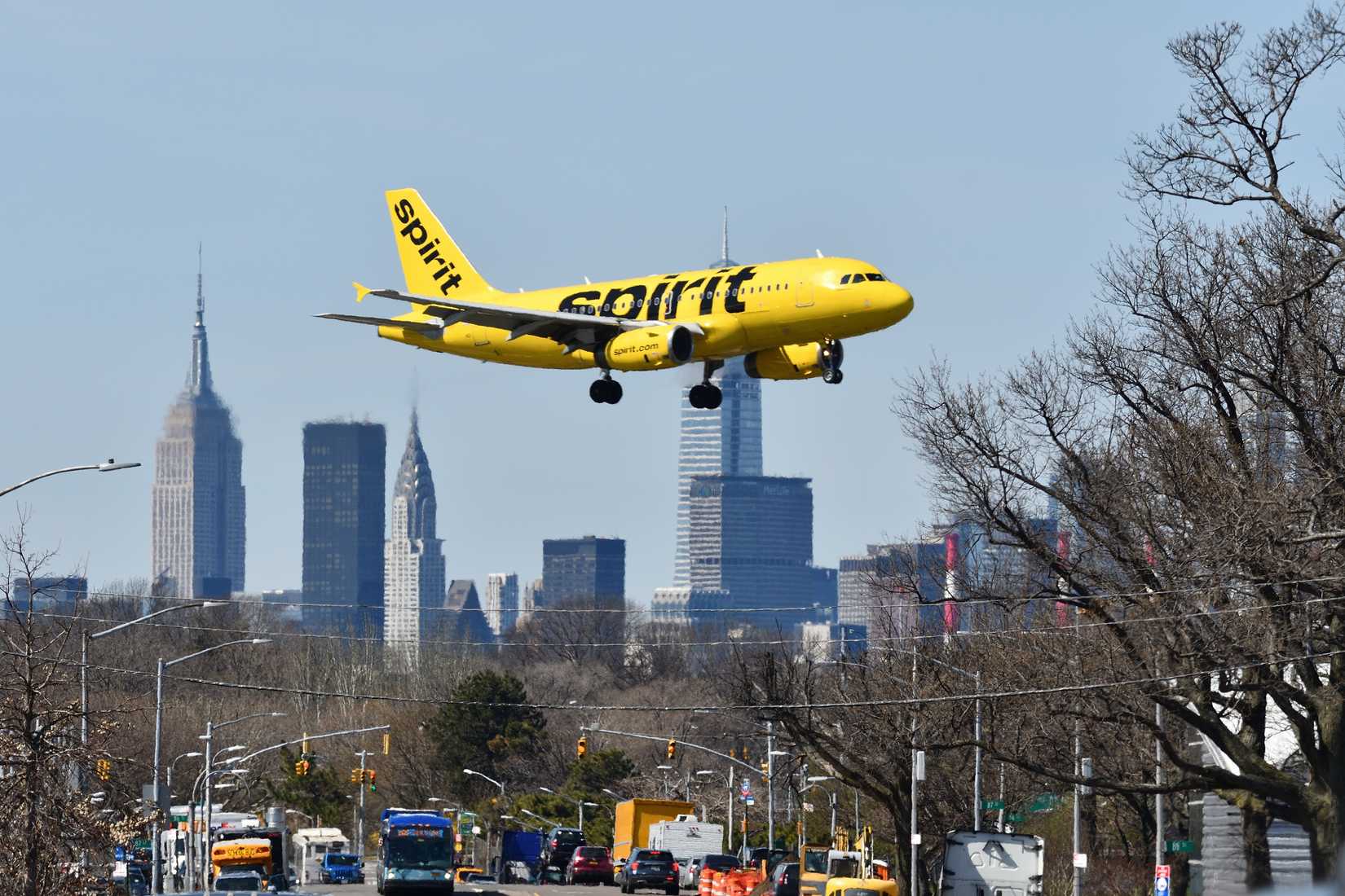 Spirit Airlines landing at LaGuardia New York in background