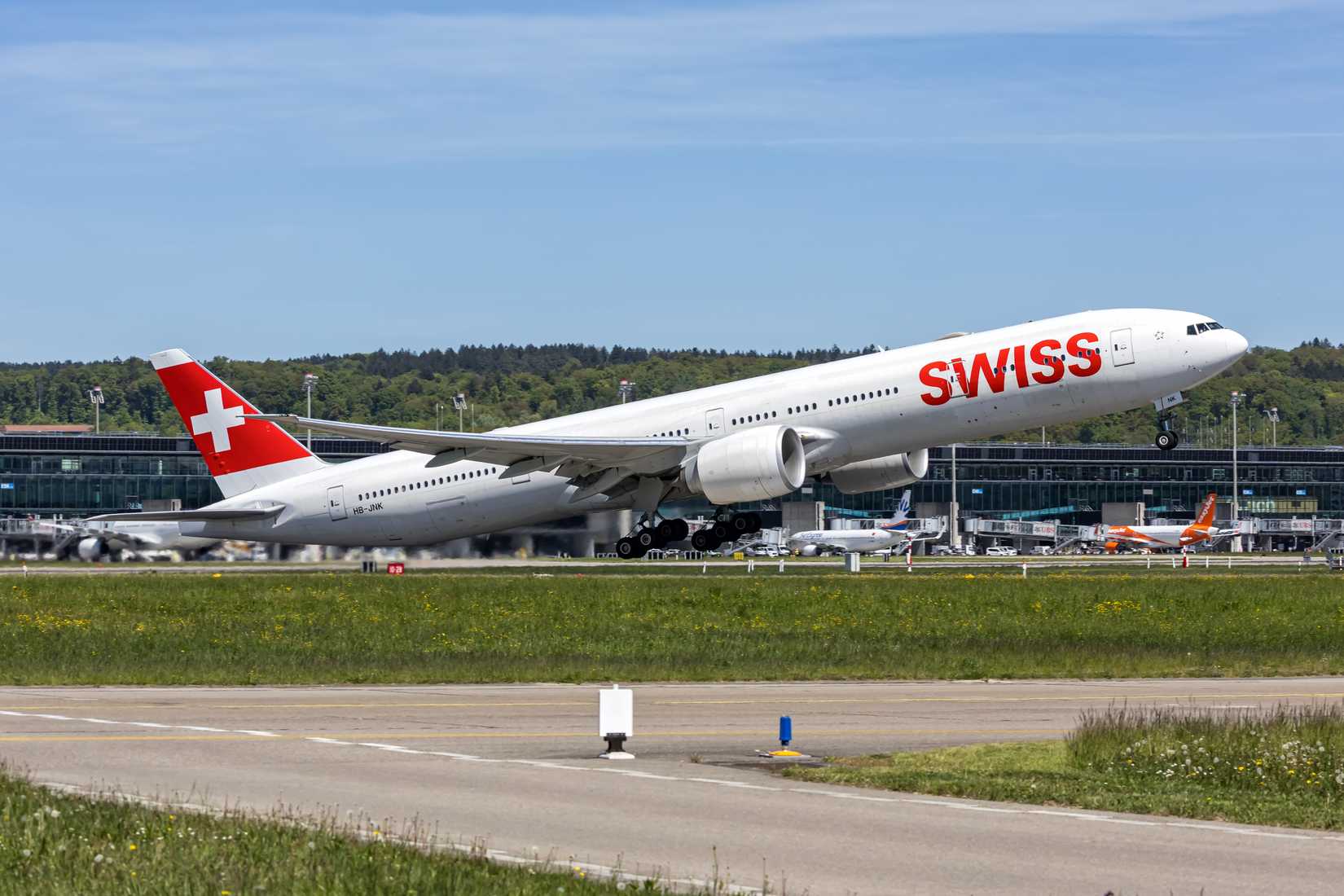 Swiss Boeing 777-300ER airplane at Zurich airport in Switzerland.