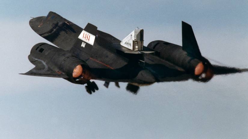 This photograph shows the LASRE pod on the upper rear fuselage of an SR-71 aircraft during take-off of the first flight to experience an in-flight cold flow test