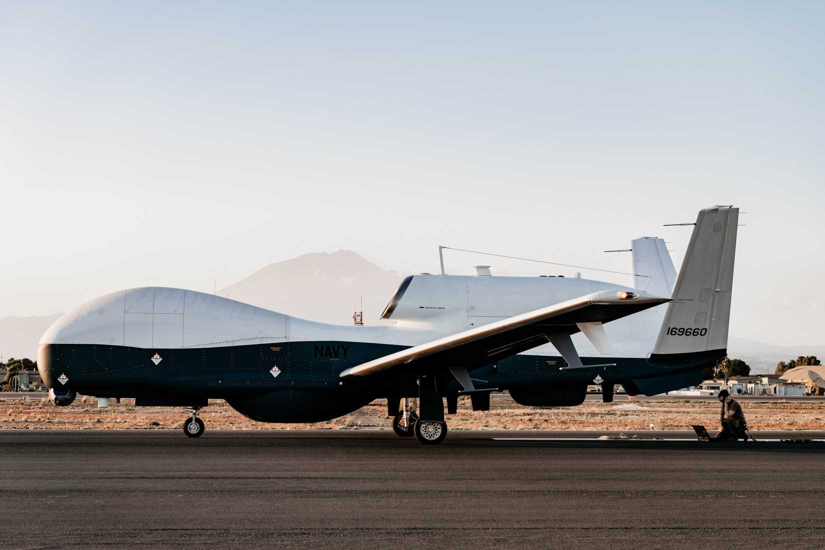 Unmanned Patrol Squadron (VUP) 19 post-flight checks on an MQ-4C Triton at Naval Air Station (NAS) Sigonella, Italy