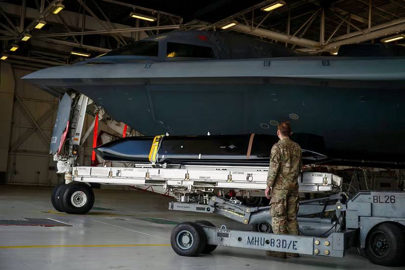 A photo of a LRASM in the process of being loaded into a B-2 Spirit bomber.