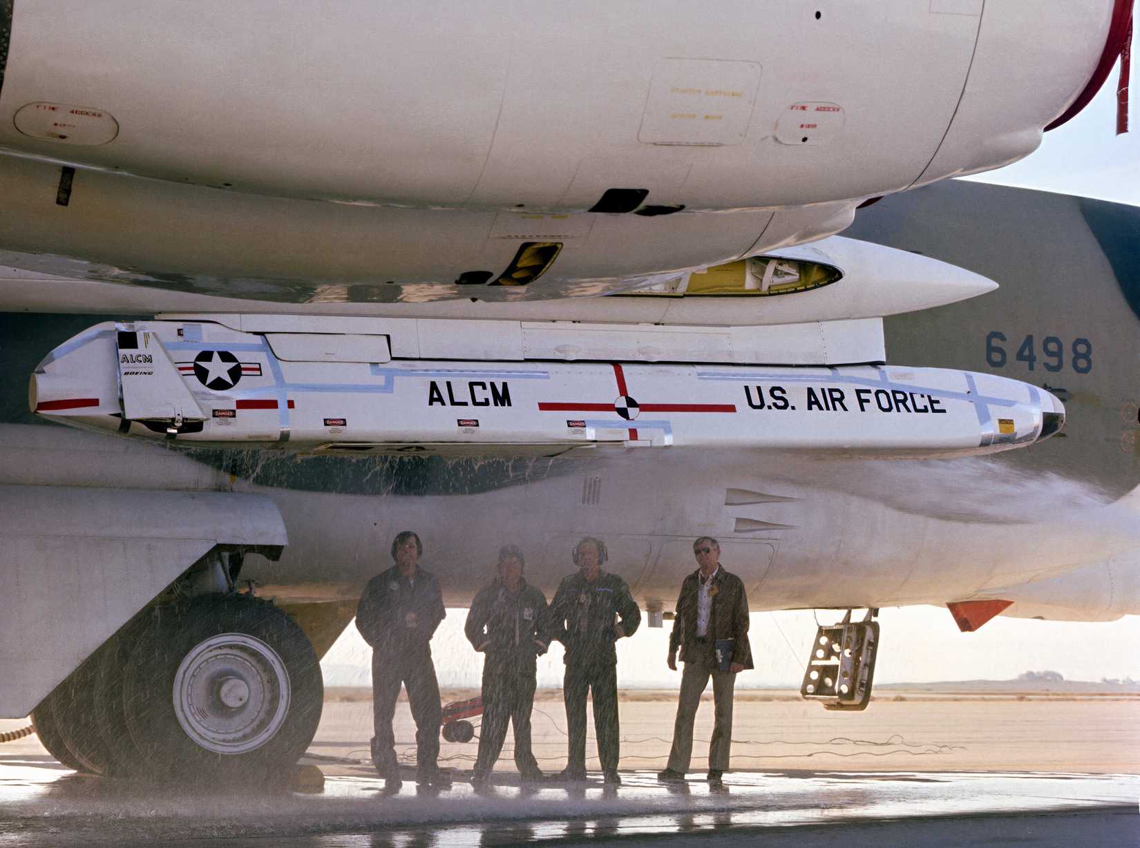 A photograph of a B-52 with a single ALCM mounted underwing. 