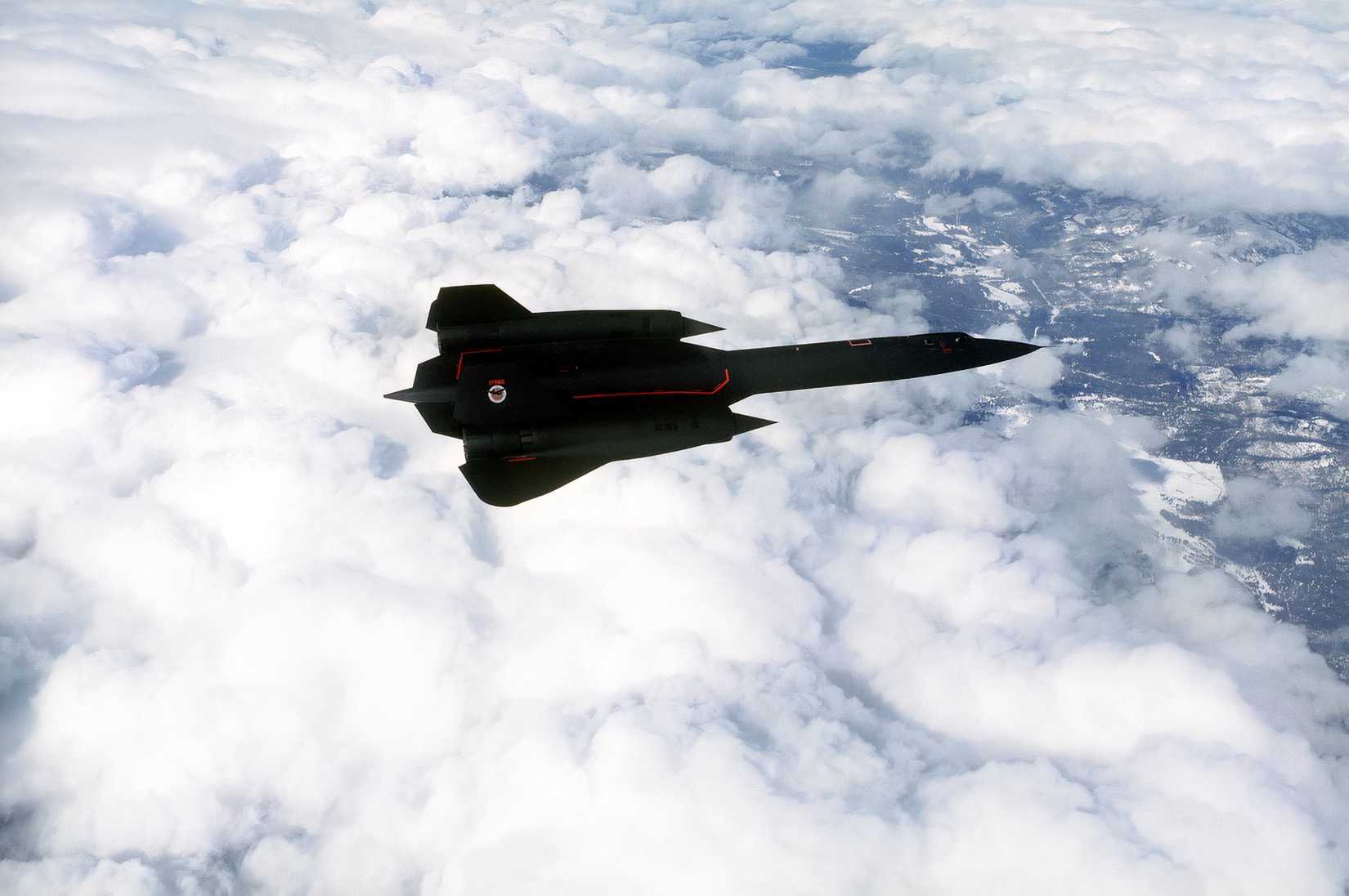 A photo of an SR-71 flying above the clouds.