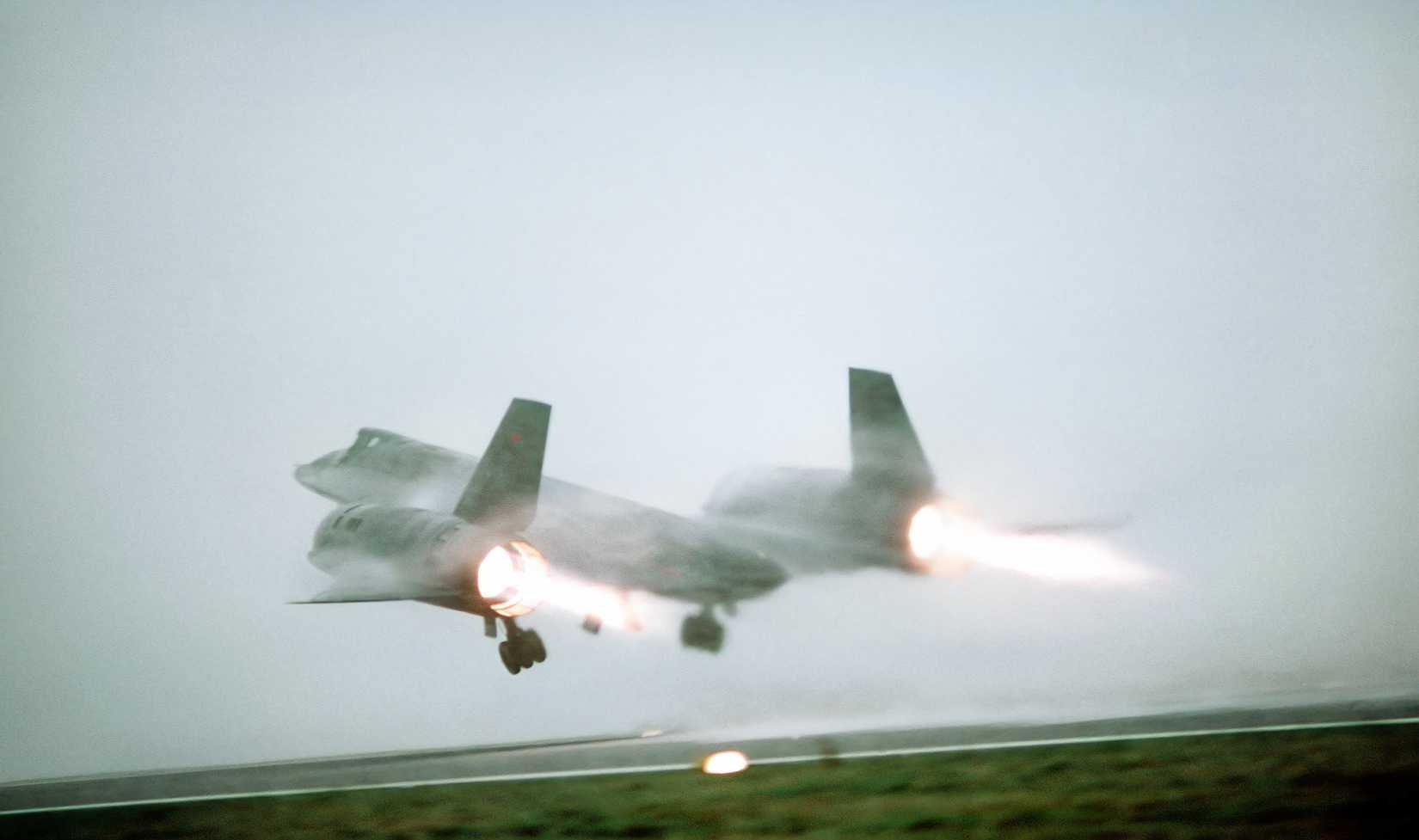 A photo of an SR-71 taking off, the aircraft is partially obscured by fog in the background.