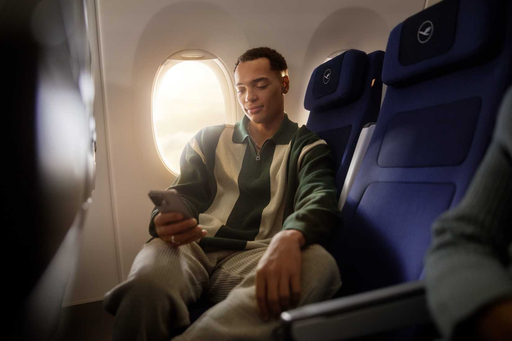 Lufthansa Passenger On Phone