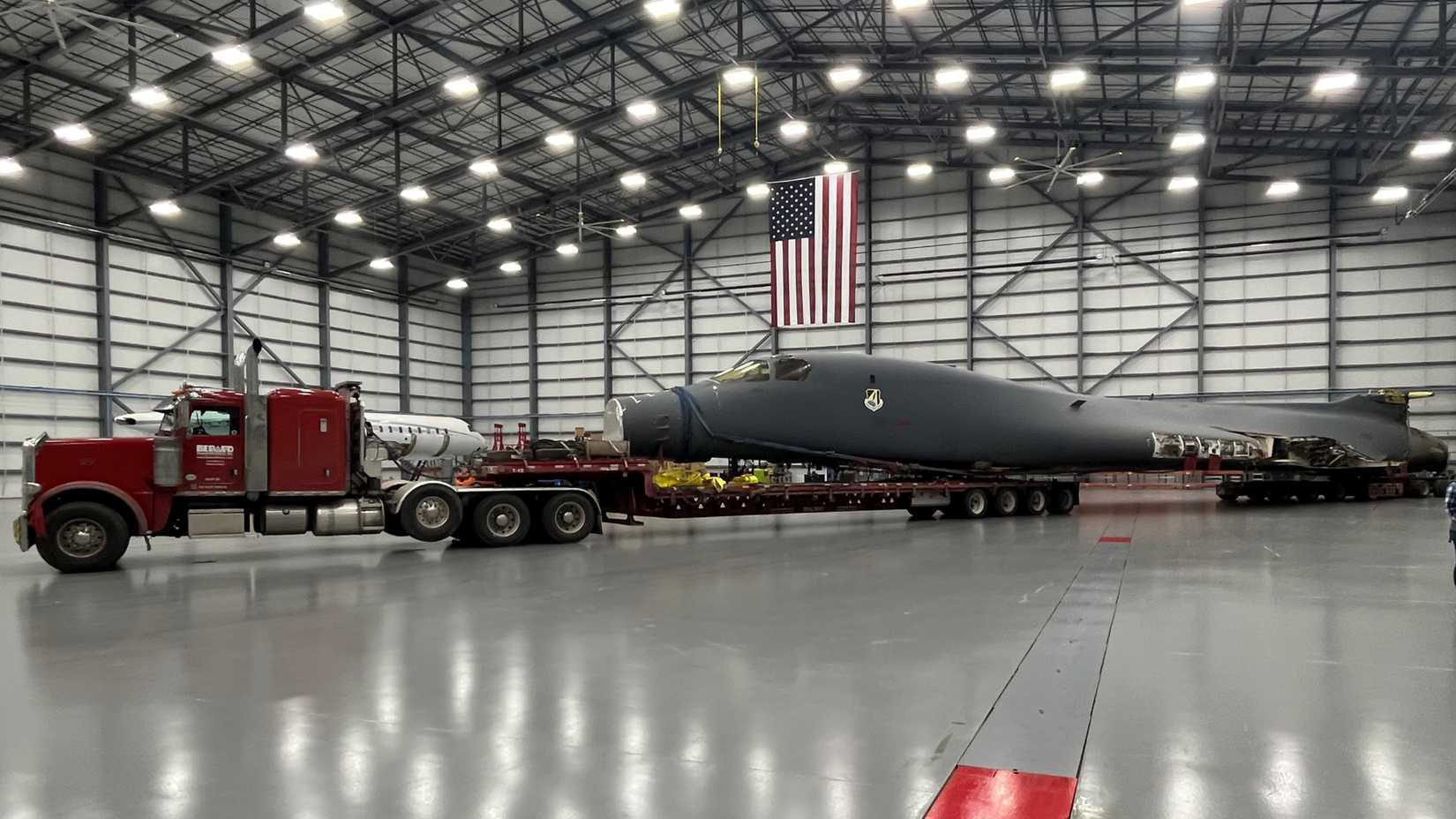 A B-1B Lancer stops in its final destination inside a hangar at Wichita State University’s National Institute for Aviation Research