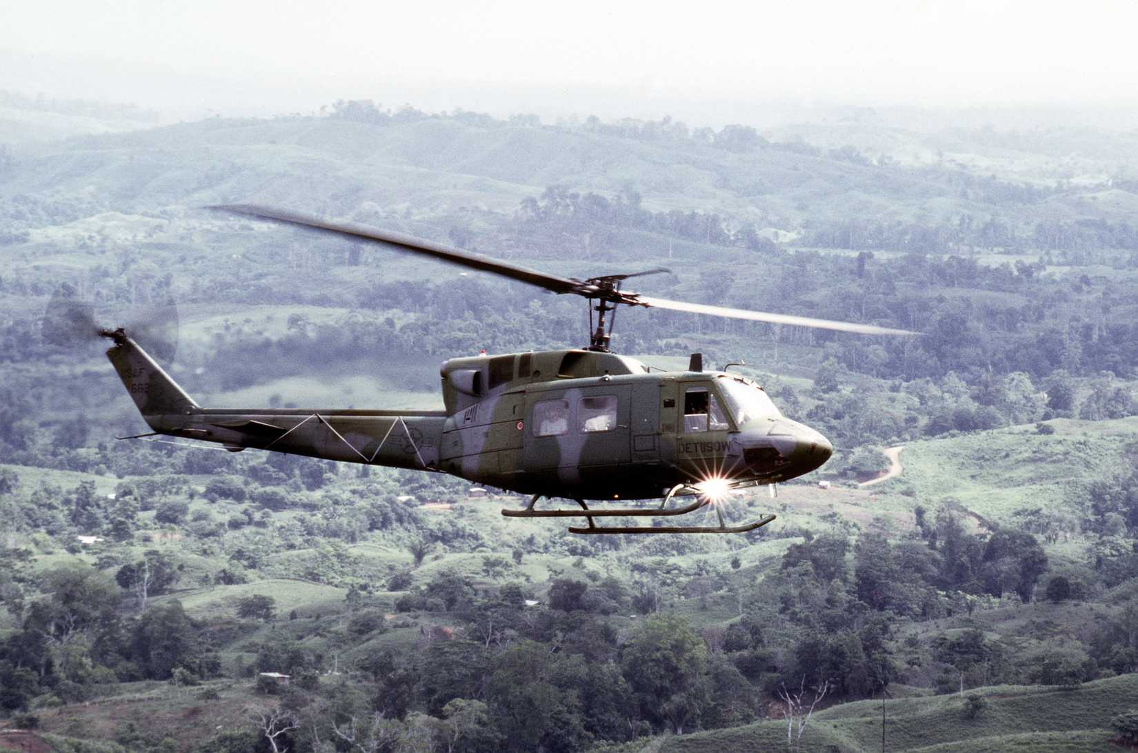 A Detachment 1, 1ST Special Operations Wing UH-1N Iroquois helicopter flies over the countryside during a search and rescue mission