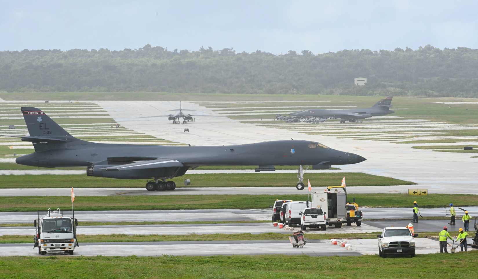 A pair of B-1B Lancers assigned to the 34th Expeditionary Bomb Squadron taxi to be parked at Andersen AFB, Guam