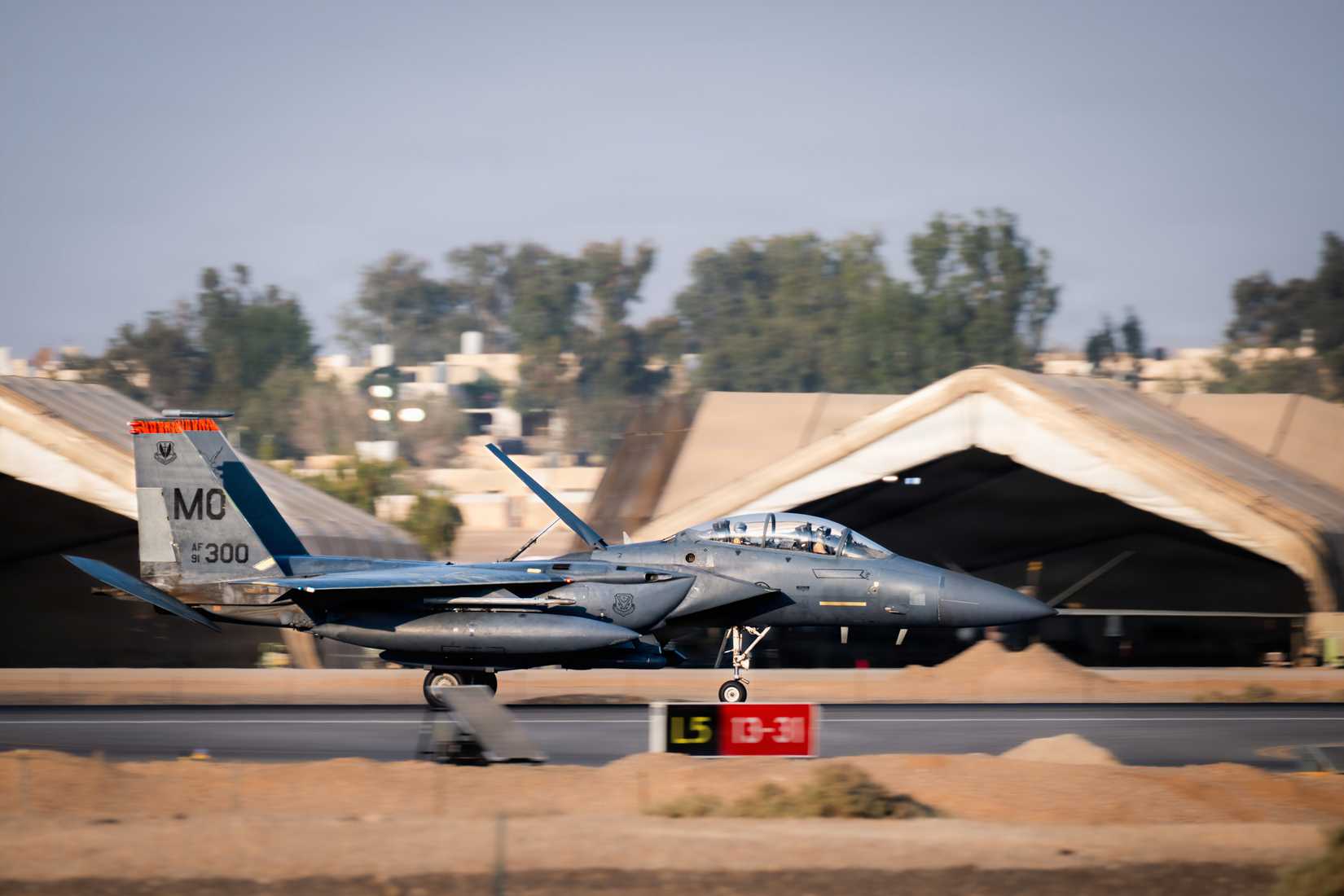 A U.S. Air Force F-15E Strike Eagle aircraft lands in the U.S. Central Command area of responsibility