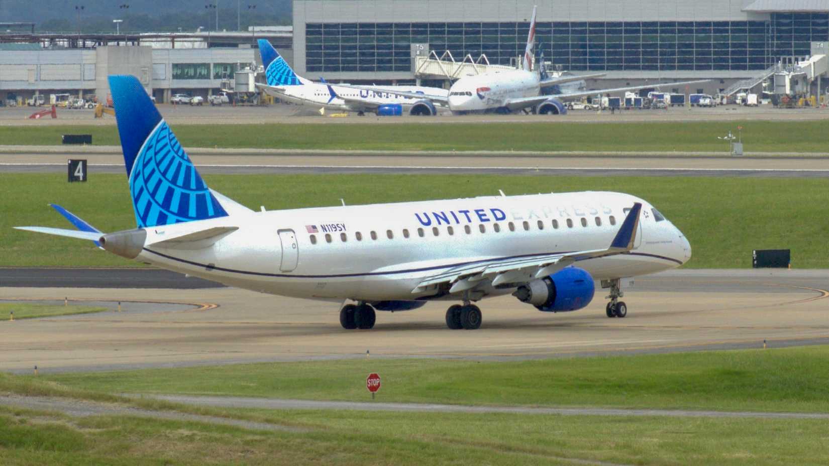 A United Express Embraer E-175LR operated by SkyWest Airlines taxis out for departure in Nashville, Tennessee at Nashville International Airport-1
