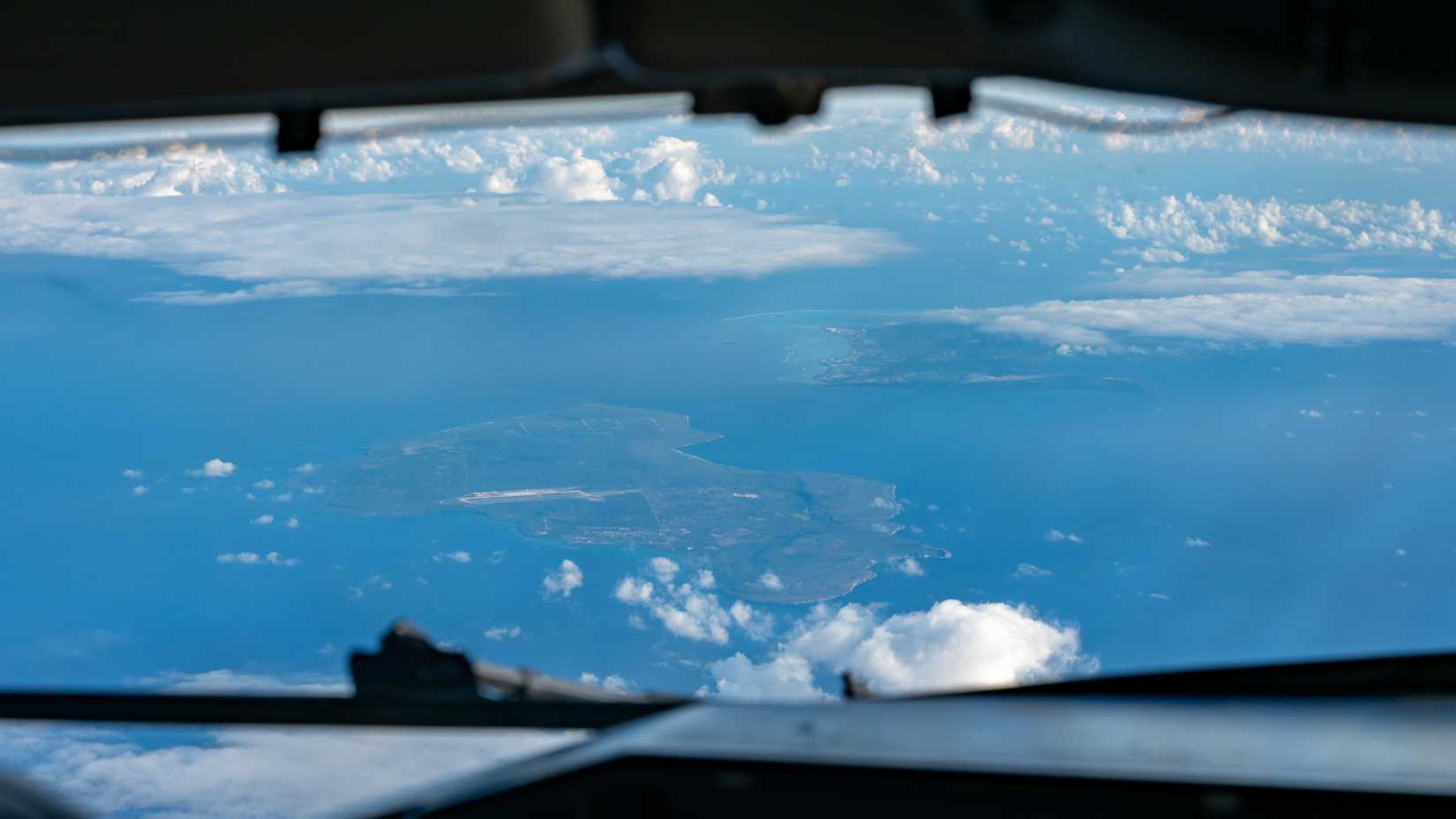 A view of Tinian and Saipan, two islands in the Northern Mariana Island chain, as seen from a U.S. Air Force KC-135 Stratotanker