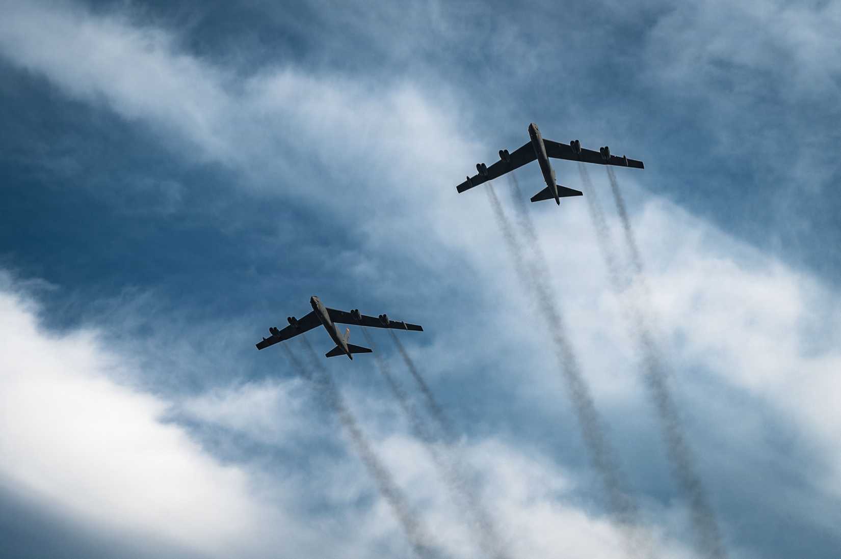 Air Force B-52H Stratofortresses assigned to the 5th Bomb Wing fly over the North Dakota State Fair