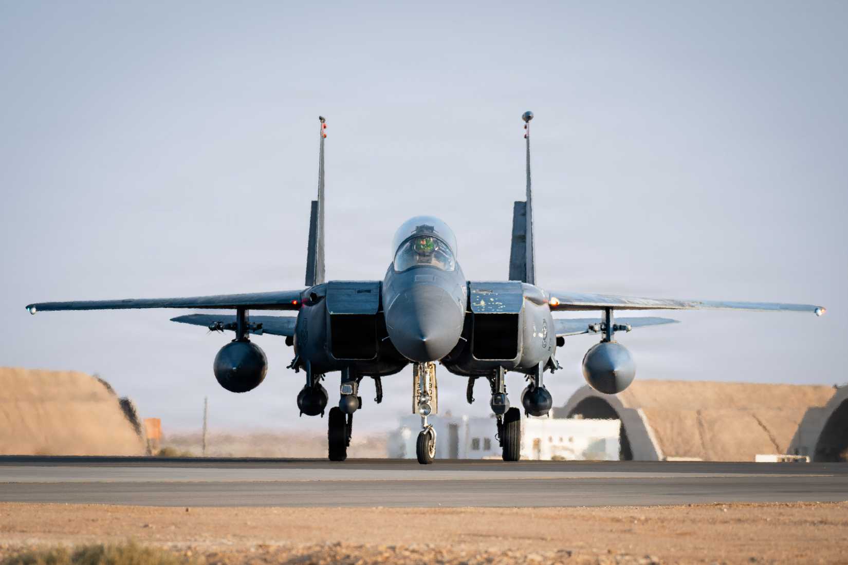Air Force F-15E Strike Eagle aircraft taxis to a hangar in the U.S. Central Command area of responsibility