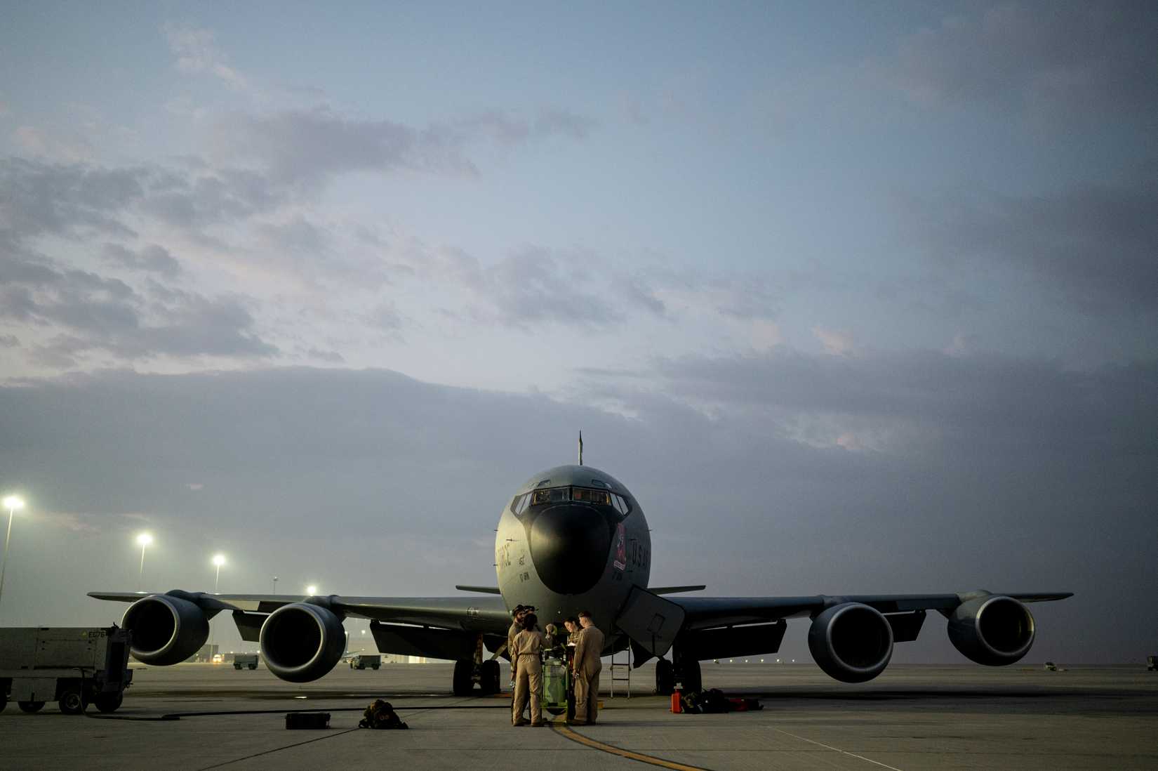 Air Force KC-135 Stratotanker aircrew members assigned to the 91st Expeditionary Air Refueling Squadron, conduct pre-flight maintenance review