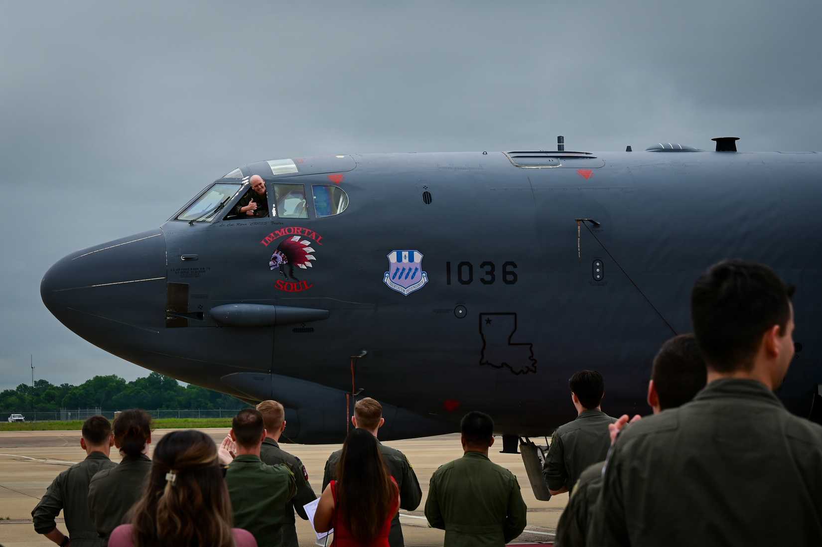 Air Force Lt. Col. Ryan Taylor, 96th Bomb Squadron commander, reveals his name on a B-52H Stratofortress aircraft
