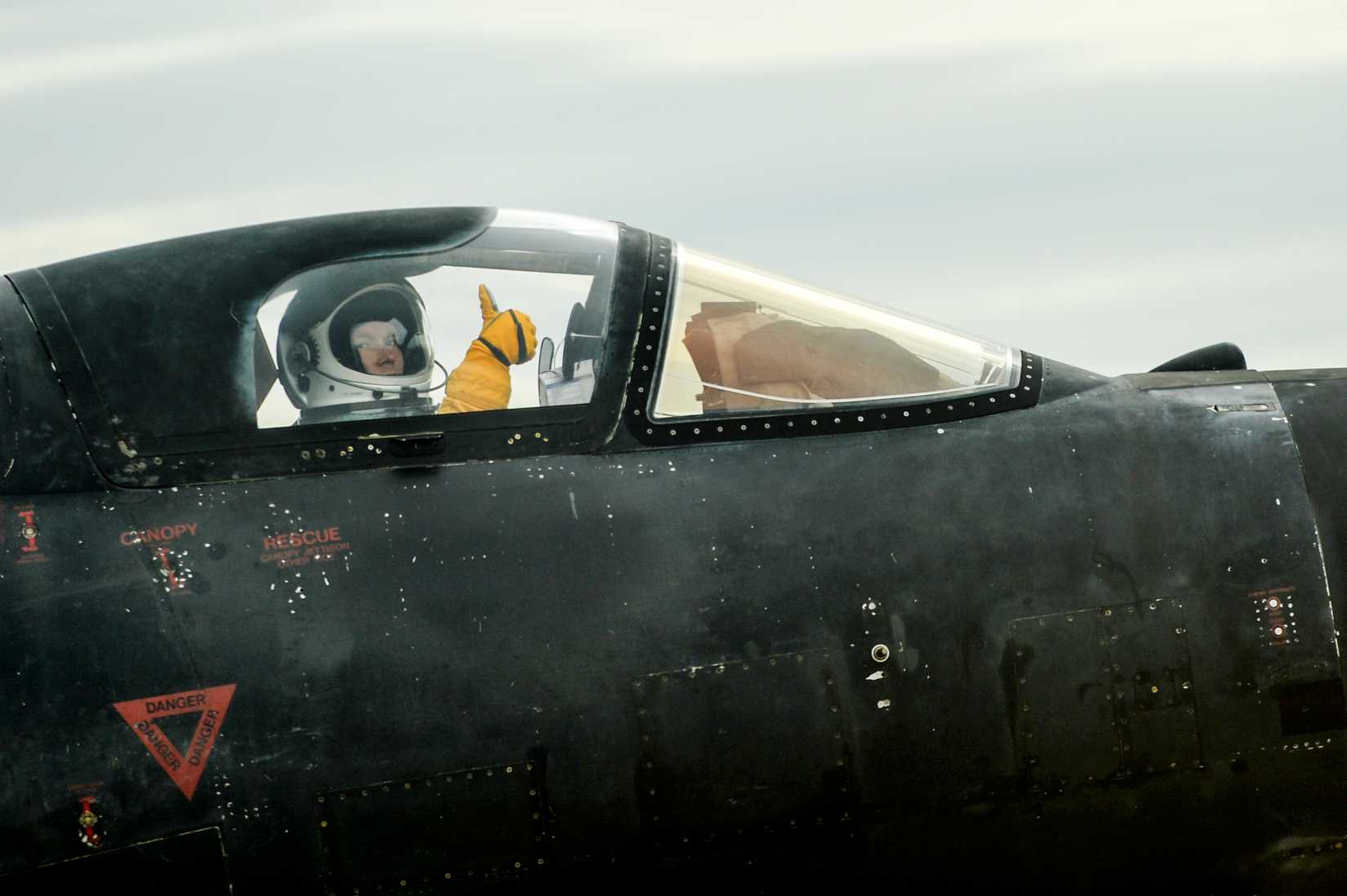 Air Force Maj. John, U2S Dragon Lady pilot assigned to the 9th Reconnaissance Wing gives a thumbs up as he takes off